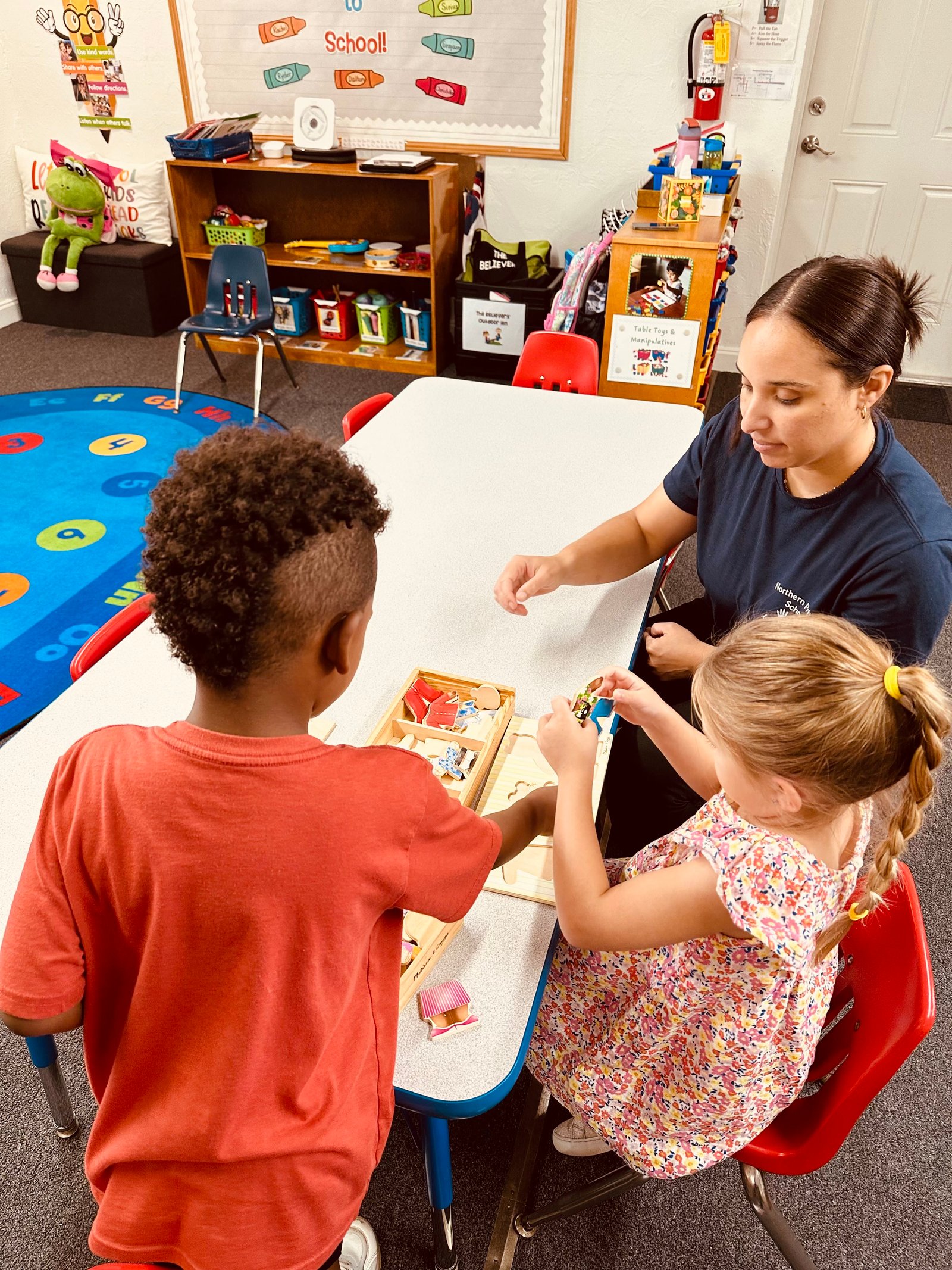 Kids playing with toys at table