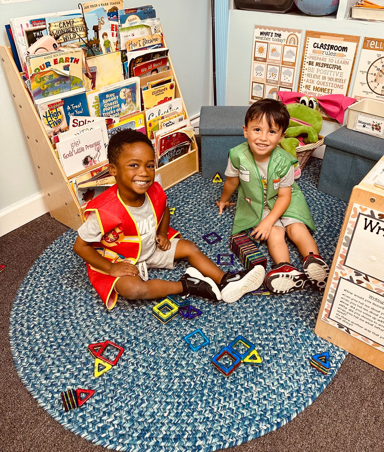 Children drawing with crayons at a classroom table